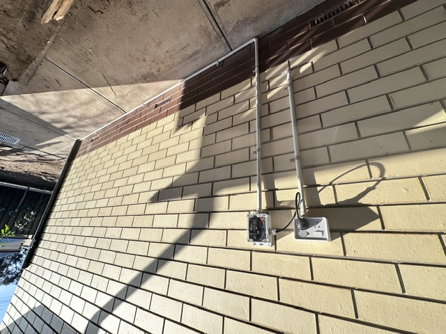 Twin 12-volt outdoor points with tidy conduit runs
