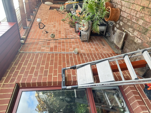 Bare brick wall before timber cladding